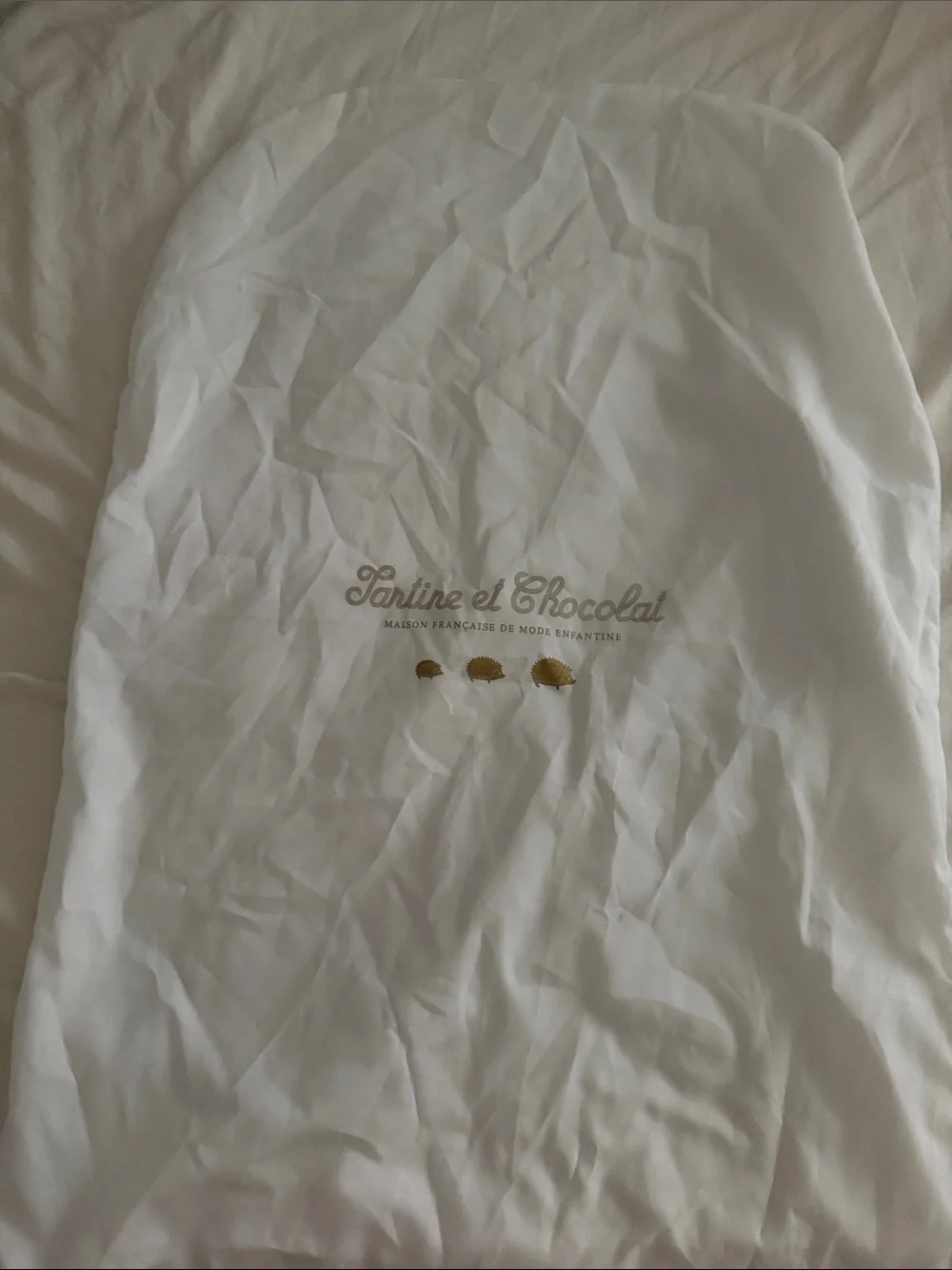 Tartine et Chocolat White Garment Bag with Gold Hedgehog Accents